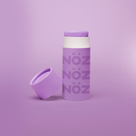 Load image into Gallery viewer, Purple Nöz sunscreen stick with cap off, tilted against base of stick. All against a pale purple gradient background. 
